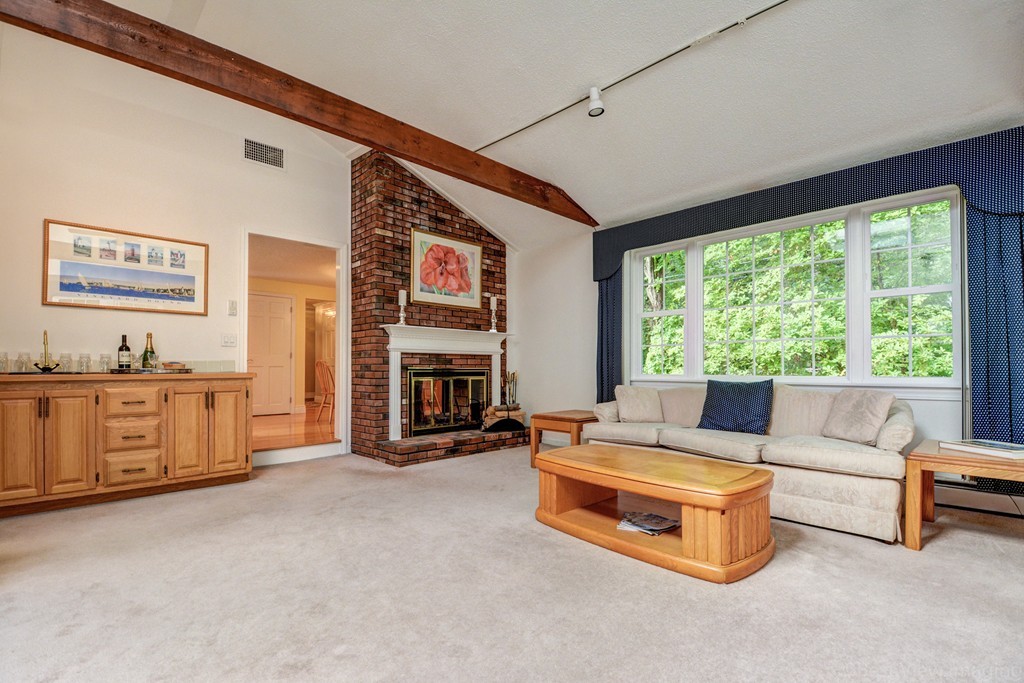 351 Liberty Square Road Boxborough, MA 01719 - Photo 17 of 30 a living room with furniture and a fireplace
