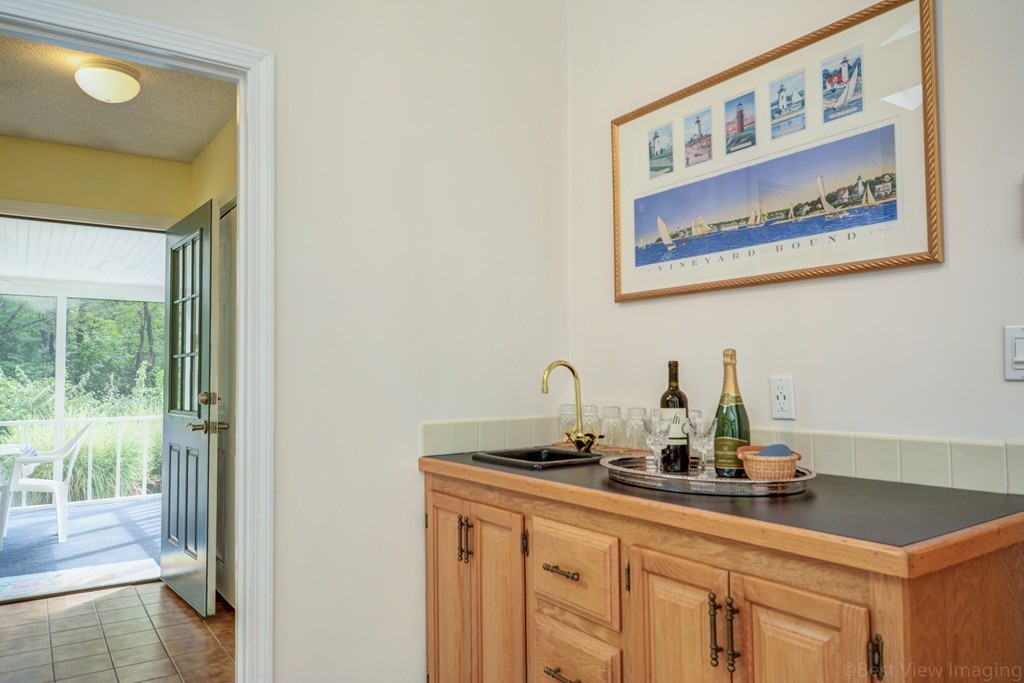 351 Liberty Square Road Boxborough, MA 01719 - Photo 18 of 30 a bathroom with a sink and a mirror