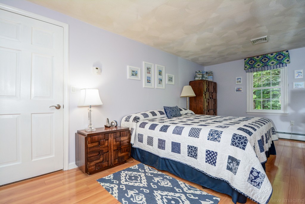 351 Liberty Square Road Boxborough, MA 01719 - Photo 20 of 30 a bedroom with a bed and a window