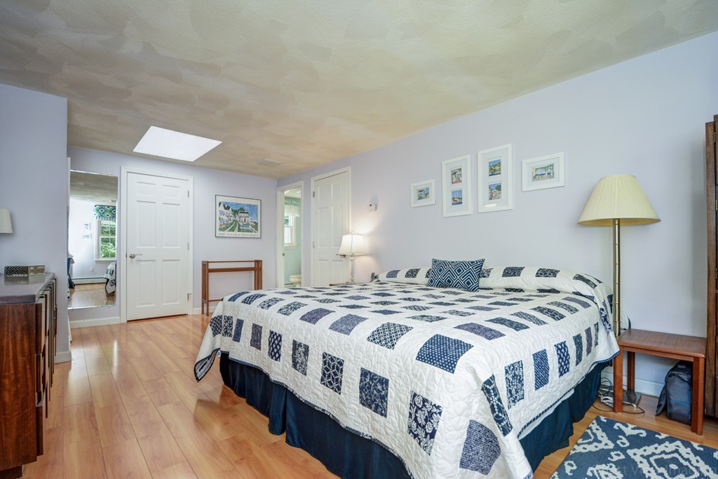 351 Liberty Square Road Boxborough, MA 01719 - Photo 21 of 30 a bedroom with a bed a table and chair