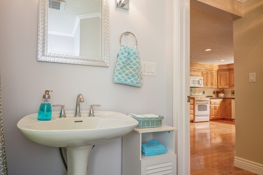 351 Liberty Square Road Boxborough, MA 01719 - Photo 26 of 30 a bathroom with a sink and a mirror