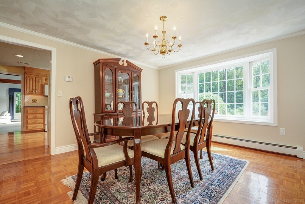 351 Liberty Square Road Boxborough, MA 01719 - Photo 9 of 30 a view of a dining room with furniture window and wooden floor