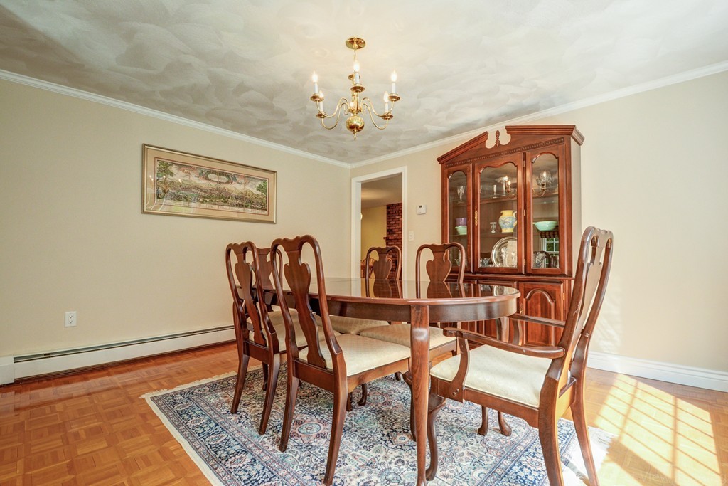 351 Liberty Square Road Boxborough, MA 01719 - Photo 10 of 30 a view of a dining room with furniture and chandelier