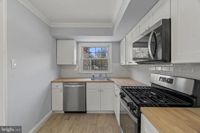 a kitchen with a stove and a sink