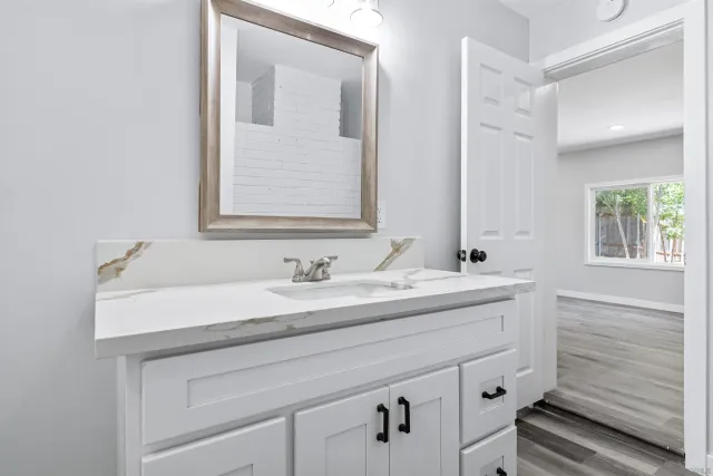 a bathroom with a sink and a mirror