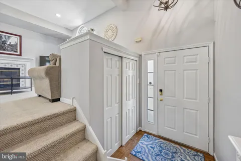 a spacious bedroom with a bed and a window