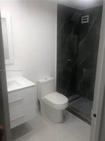 a bathroom with a toilet and a sink