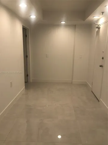 an empty room with an entryway