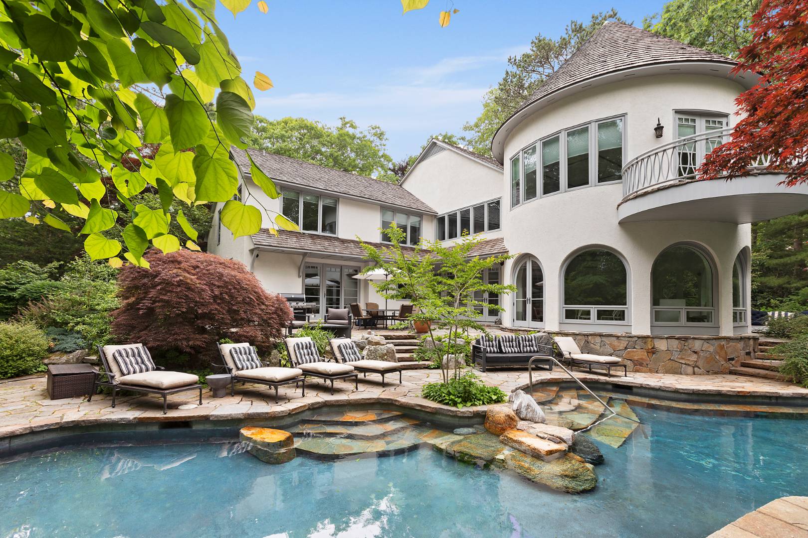 112 Georgica Close Road East Hampton, NY 11937 - Photo 1 of 46 a front view of a house with swimming pool and a yard