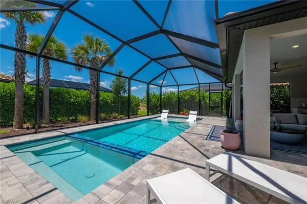 a view of a backyard with sitting area