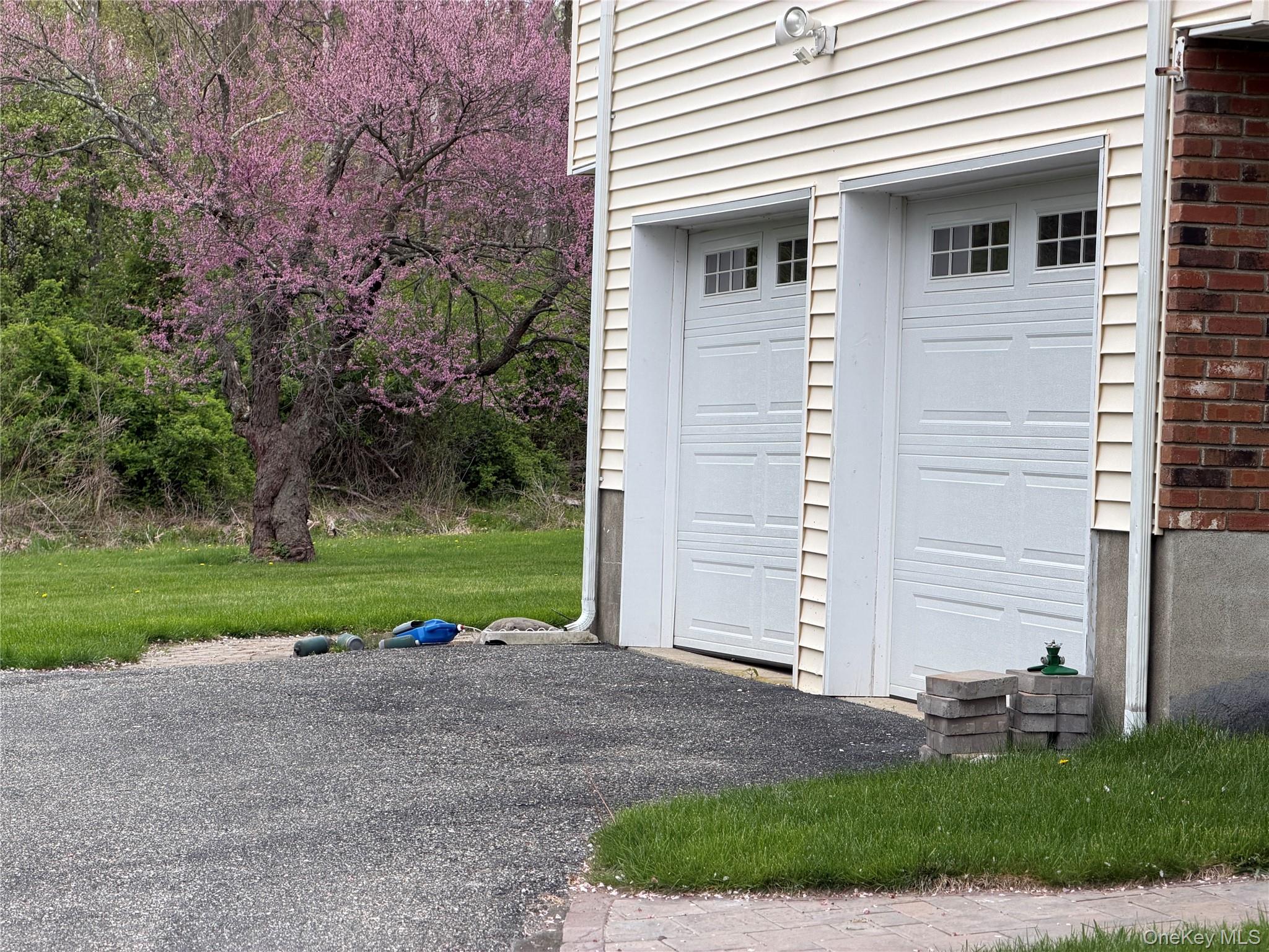 94 Booth Road Chester, NY 10918 - Photo 18 of 21 Two garage bays with panel doors and upper window inserts