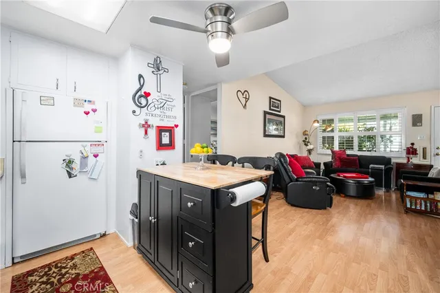 a view of kitchen with furniture and wooden floor
