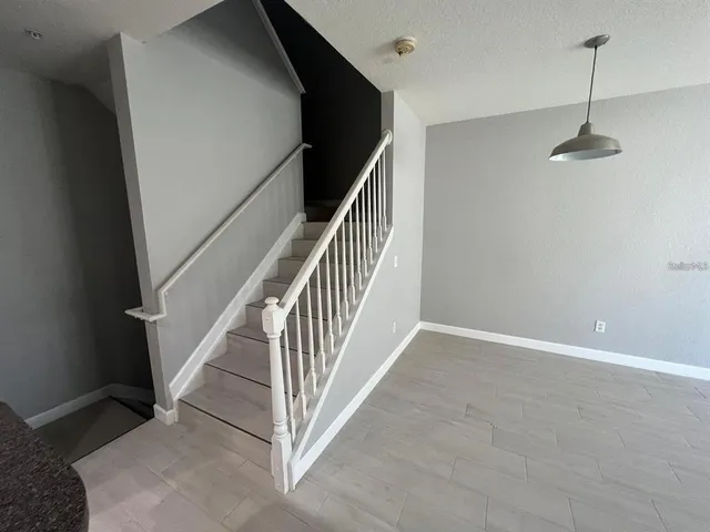 a view of a hallway with stairs