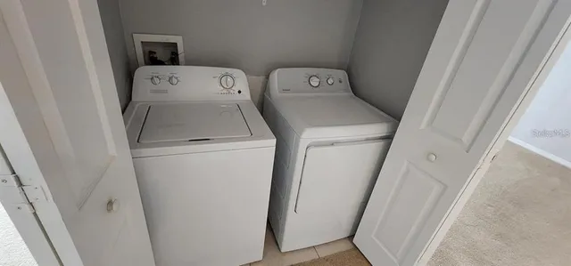 a utility room with dryer and washer