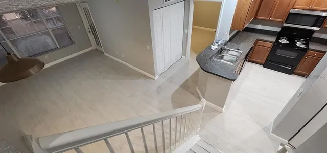 a view of staircase and wooden floor