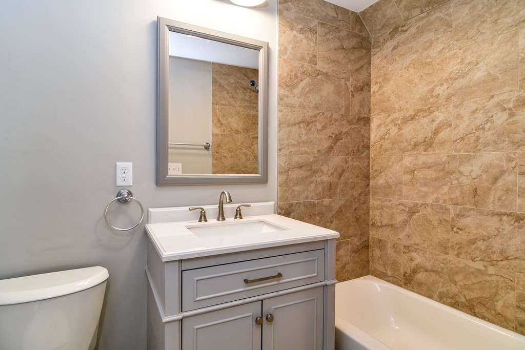 8 Everett Street Sherborn, MA 01770 - Photo 14 of 25 a bathroom with a sink a toilet and shower