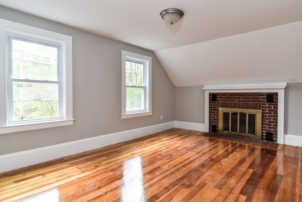 8 Everett Street Sherborn, MA 01770 - Photo 17 of 25 a view of an empty room with wooden floor and a window