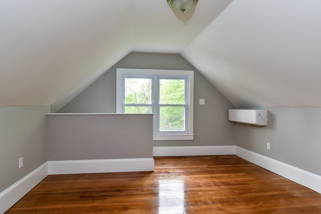 8 Everett Street Sherborn, MA 01770 - Photo 18 of 25 an empty room with wooden floor and windows