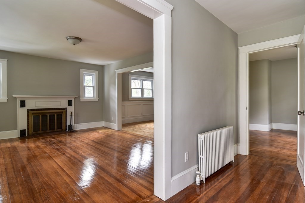 8 Everett Street Sherborn, MA 01770 - Photo 4 of 25 a view of a livingroom with wooden floor and staircase