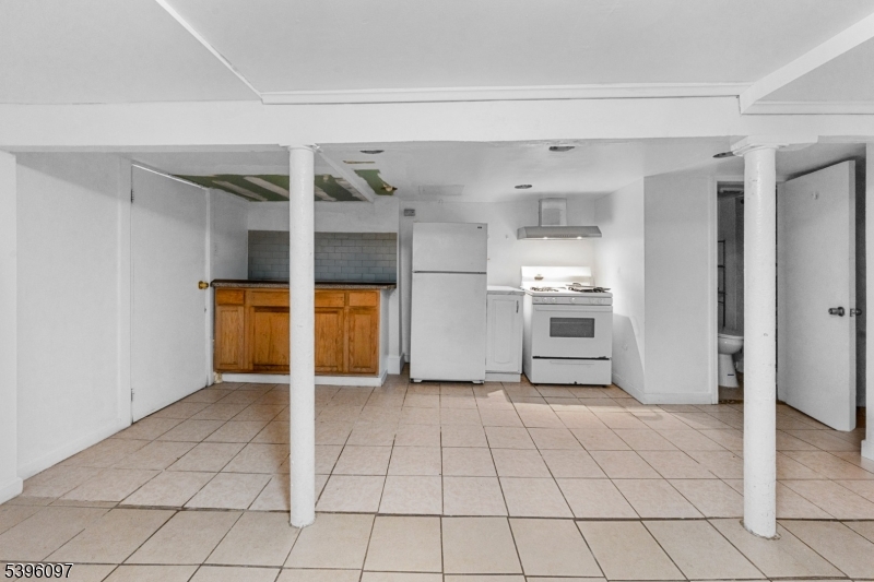 113 Second Street Elizabeth Port, NJ 07206 - Photo 1 of 34 a view of a kitchen with a sink and an empty room
