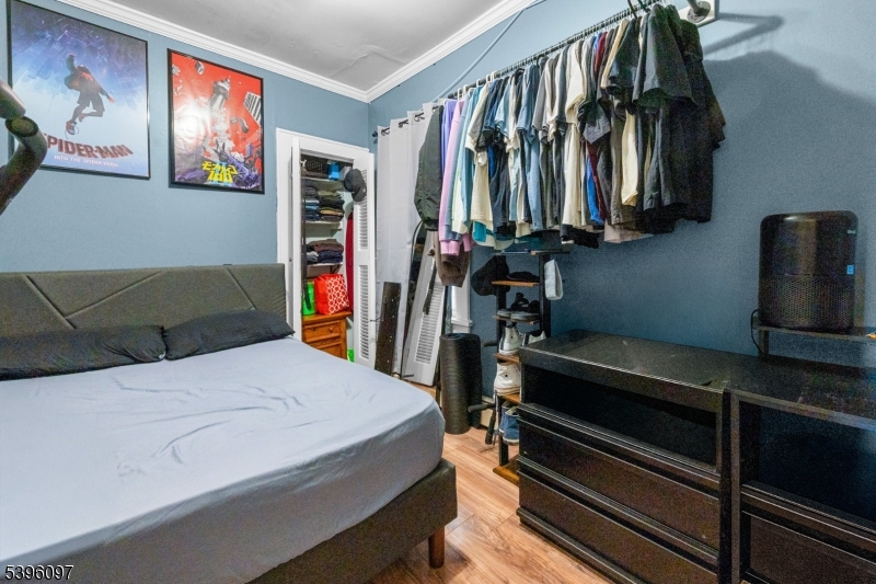 113 Second Street Elizabeth Port, NJ 07206 - Photo 11 of 34 a bedroom with a bed and a walk in closet