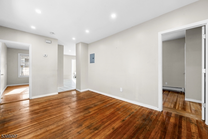 113 Second Street Elizabeth Port, NJ 07206 - Photo 13 of 32 a view of an empty room with wooden floor