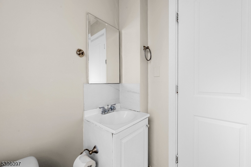113 Second Street Elizabeth Port, NJ 07206 - Photo 15 of 34 a bathroom with a sink a toilet and shower