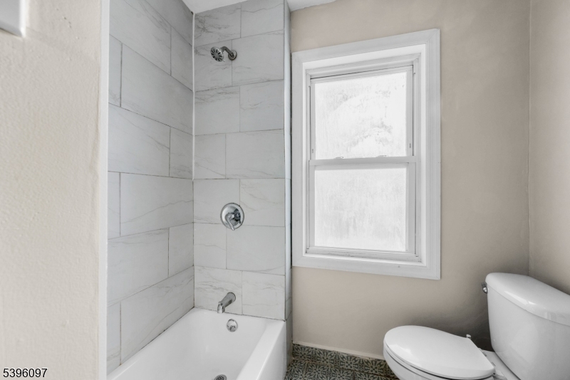113 Second Street Elizabeth Port, NJ 07206 - Photo 16 of 34 a bathroom with a toilet bathtub and shower