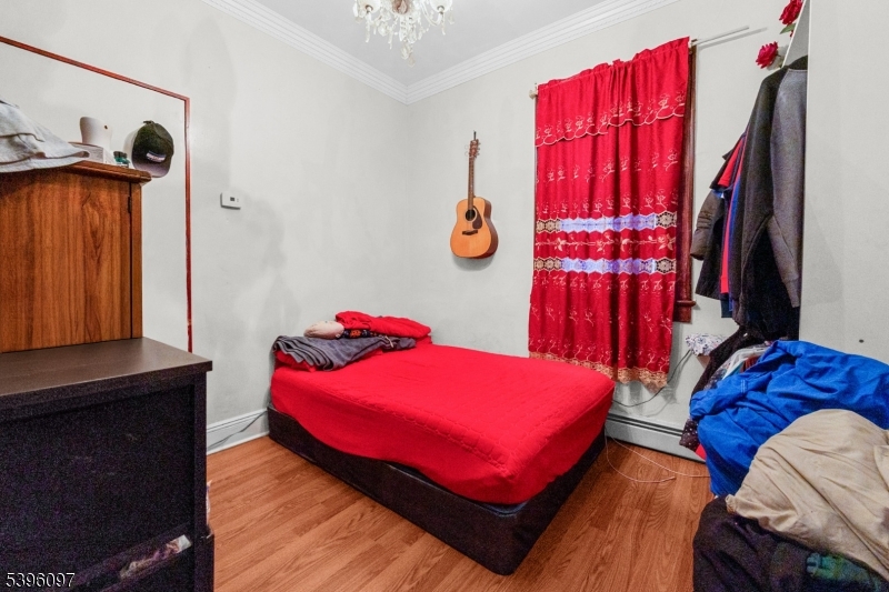 113 Second Street Elizabeth Port, NJ 07206 - Photo 20 of 32 a bedroom with a bed and a window