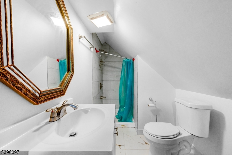 113 Second Street Elizabeth Port, NJ 07206 - Photo 23 of 32 a bathroom with a sink toilet and mirror