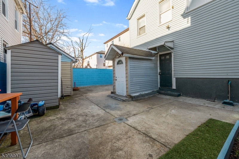 113 Second Street Elizabeth Port, NJ 07206 - Photo 27 of 34 a view of backyard of house and garage