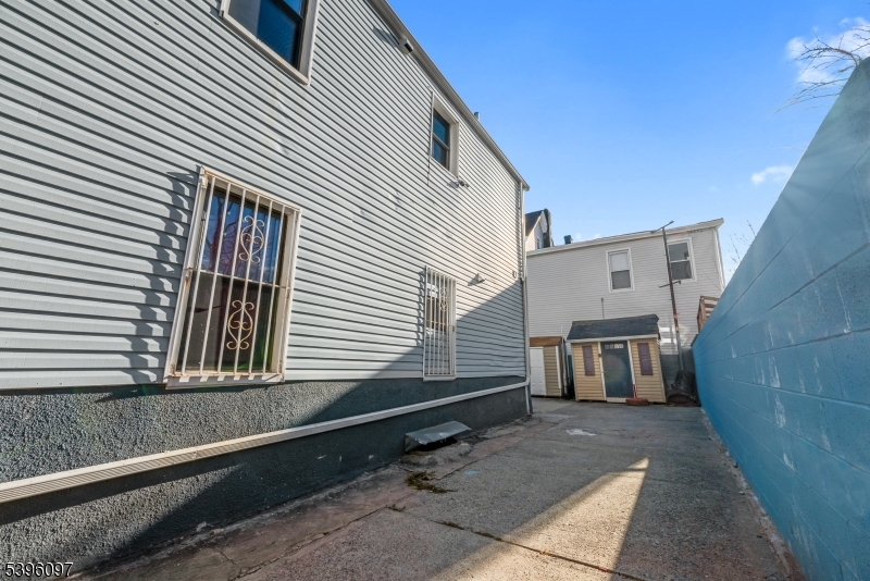 113 Second Street Elizabeth Port, NJ 07206 - Photo 3 of 32 a view of a back yard of the house