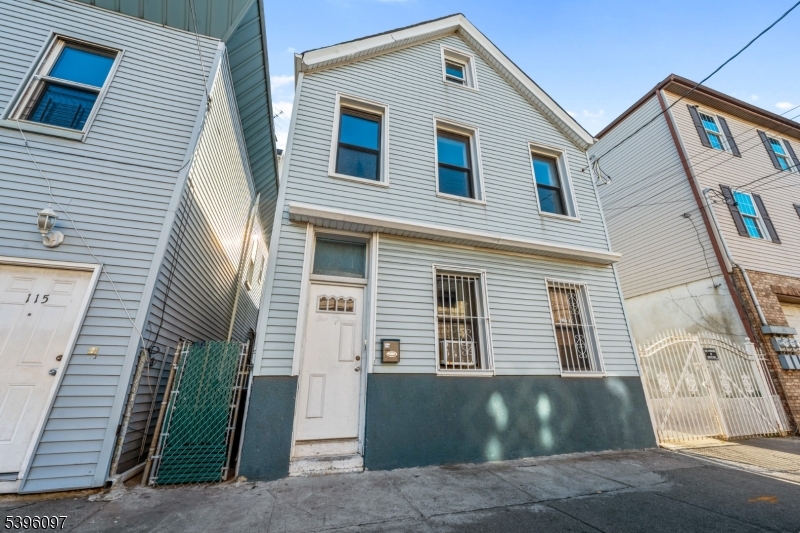 113 Second Street Elizabeth Port, NJ 07206 - Photo 33 of 34 a front view of a house with a yard