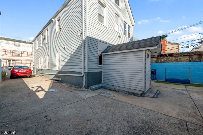 113 Second Street Elizabeth Port, NJ 07206 - Photo 4 of 32 a view of a car park in front of house