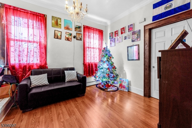 113 Second Street Elizabeth Port, NJ 07206 - Photo 8 of 34 a living room with furniture and a flat screen tv