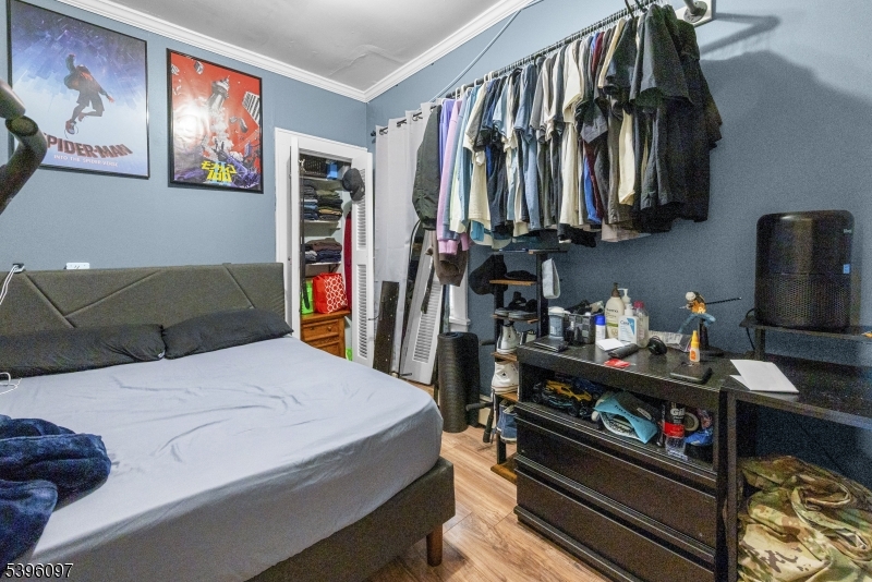 113 Second Street Elizabeth Port, NJ 07206 - Photo 10 of 34 a bedroom with a bed and a walk in closet