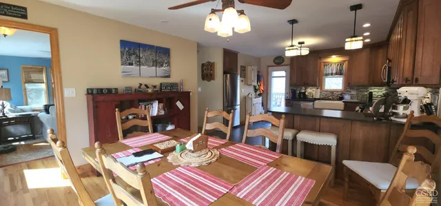 a very nice looking dining room with a table and chairs