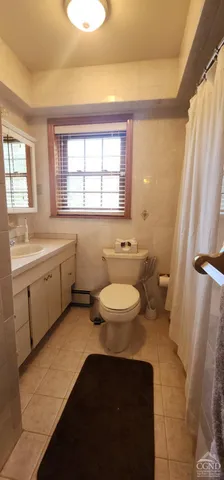 a bathroom with a sink a toilet and a bathtub