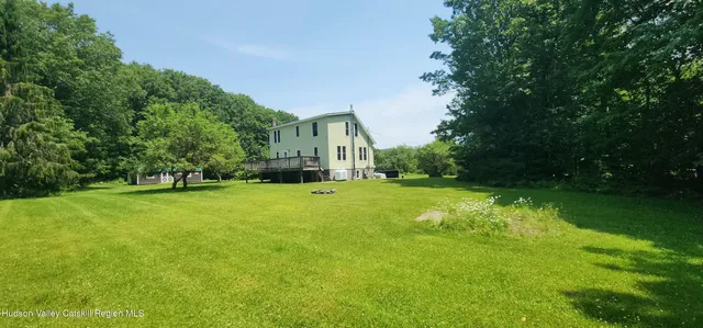 a backyard of a house with lots of green space