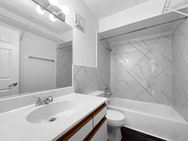 a bathroom with a sink a toilet and a bathtub
