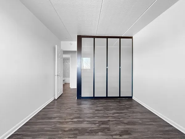 a view of front door with wooden floor