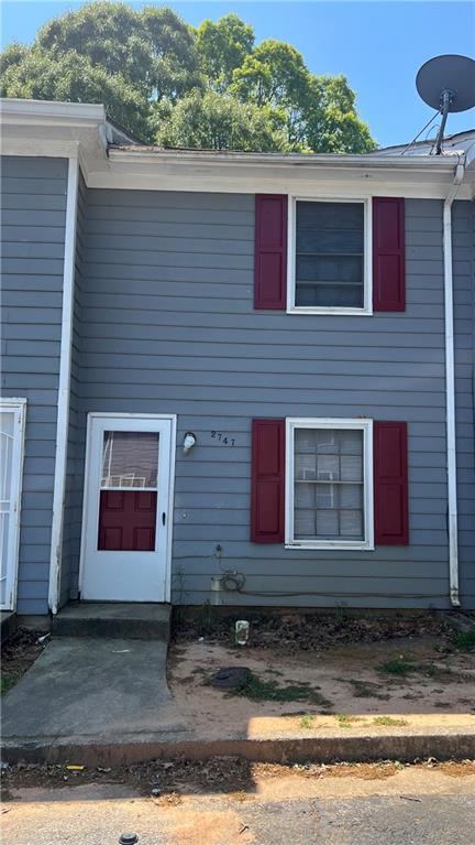 2747 Evans Mill Drive Lithonia, GA 30058 - Photo 1 of 1 a view of a house with a yard