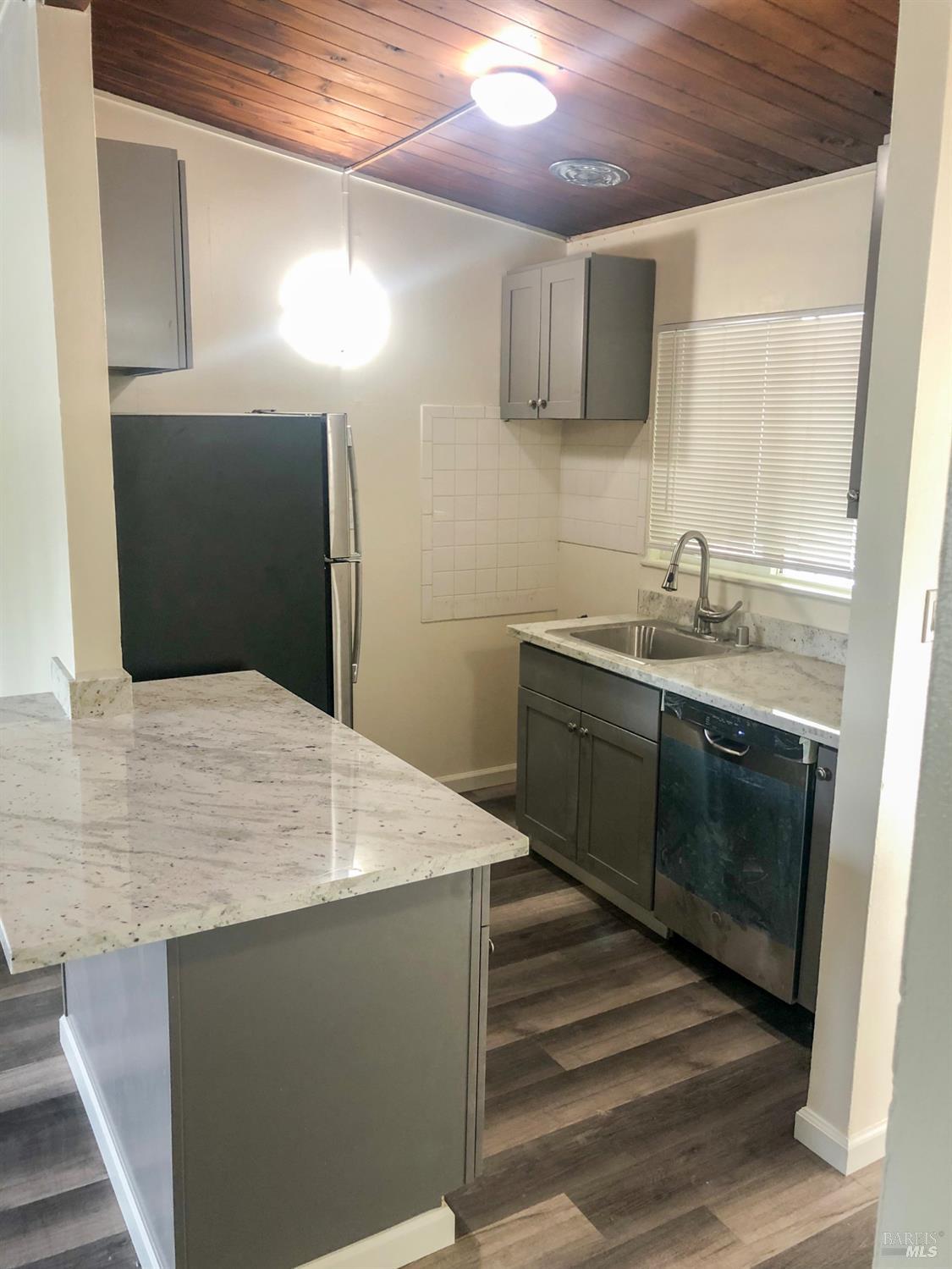 131 Kent Avenue Kentfield, CA 94904 - Photo 14 of 21 a kitchen with a sink a stove and microwave
