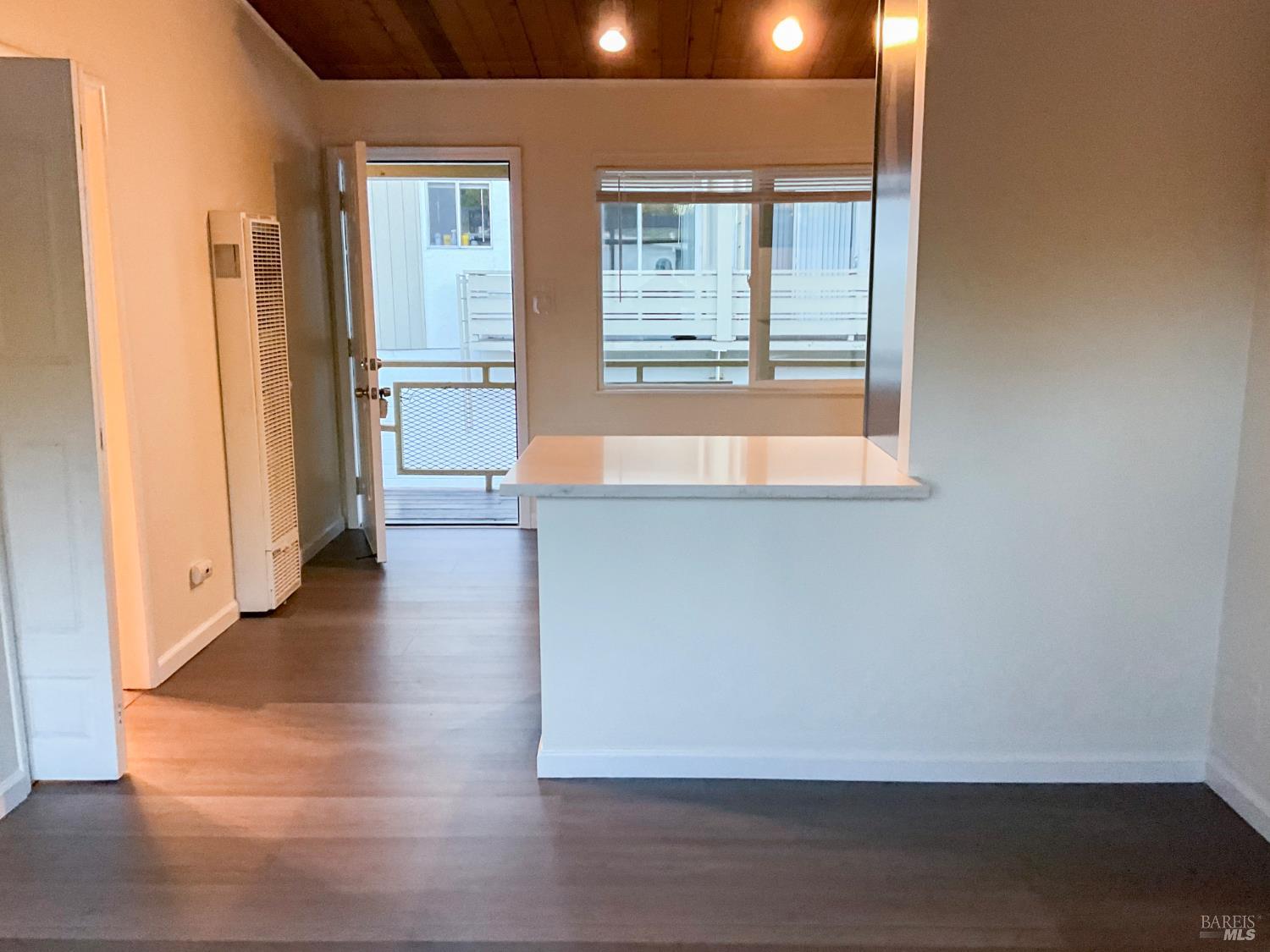 131 Kent Avenue Kentfield, CA 94904 - Photo 16 of 21 an empty room with wooden floor and windows