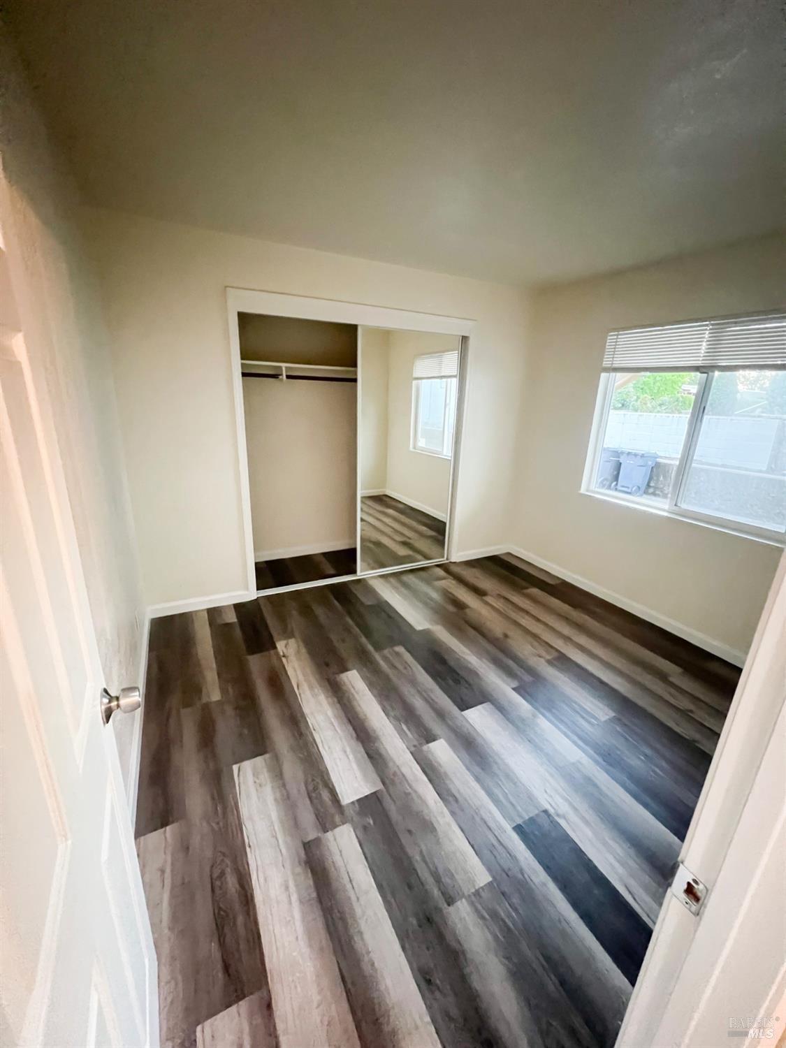 131 Kent Avenue Kentfield, CA 94904 - Photo 19 of 21 a view of a room with wooden floor and staircase