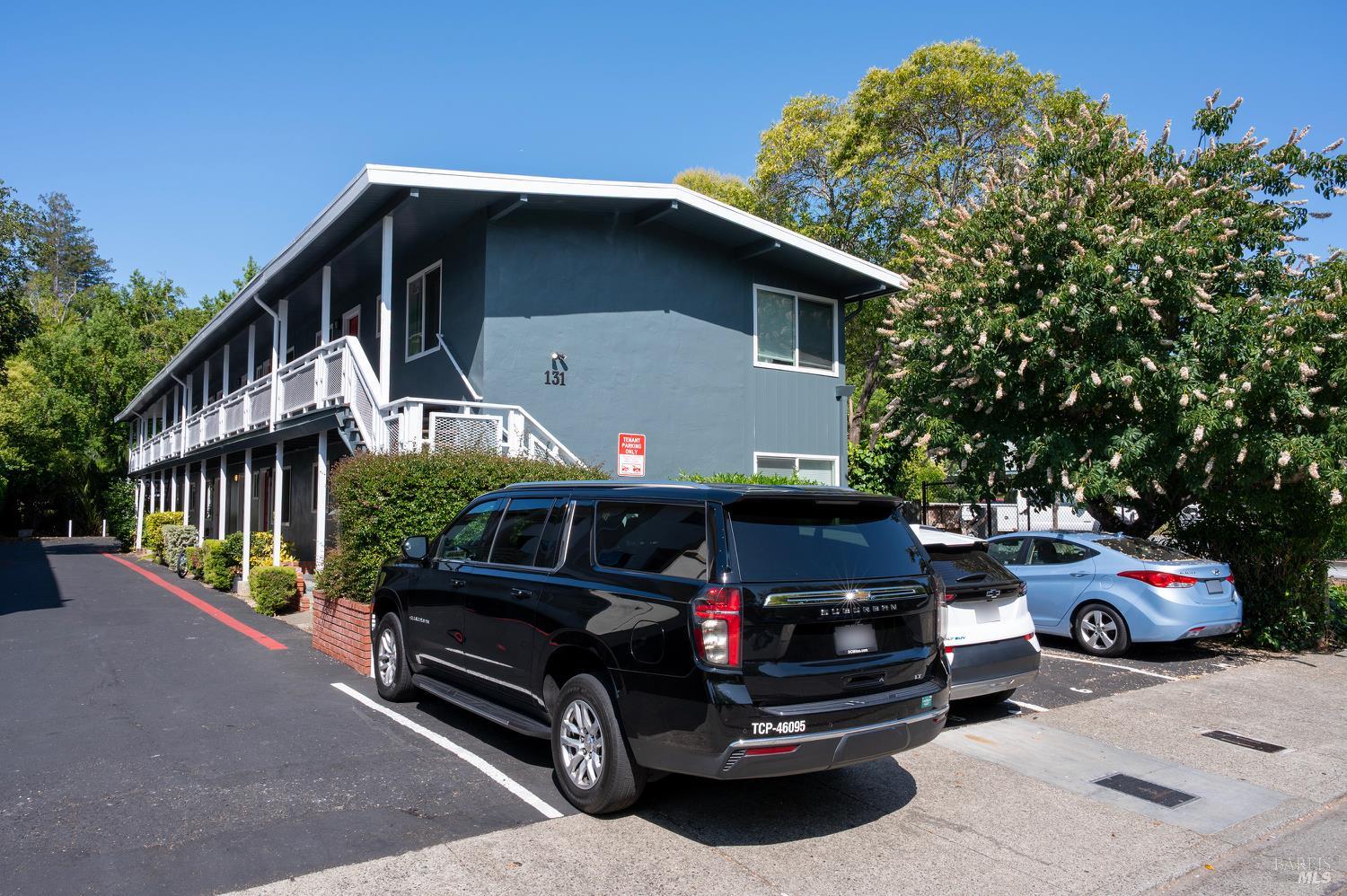131 Kent Avenue Kentfield, CA 94904 - Photo 9 of 21 a front view of a house with parking space