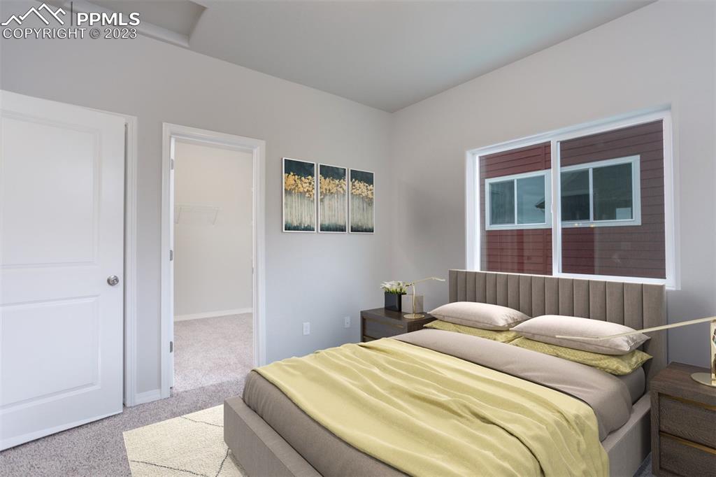 4447 Samaritan Loop Colorado Springs, CO 80916 - Photo 13 of 17 a bedroom with a bed and a window