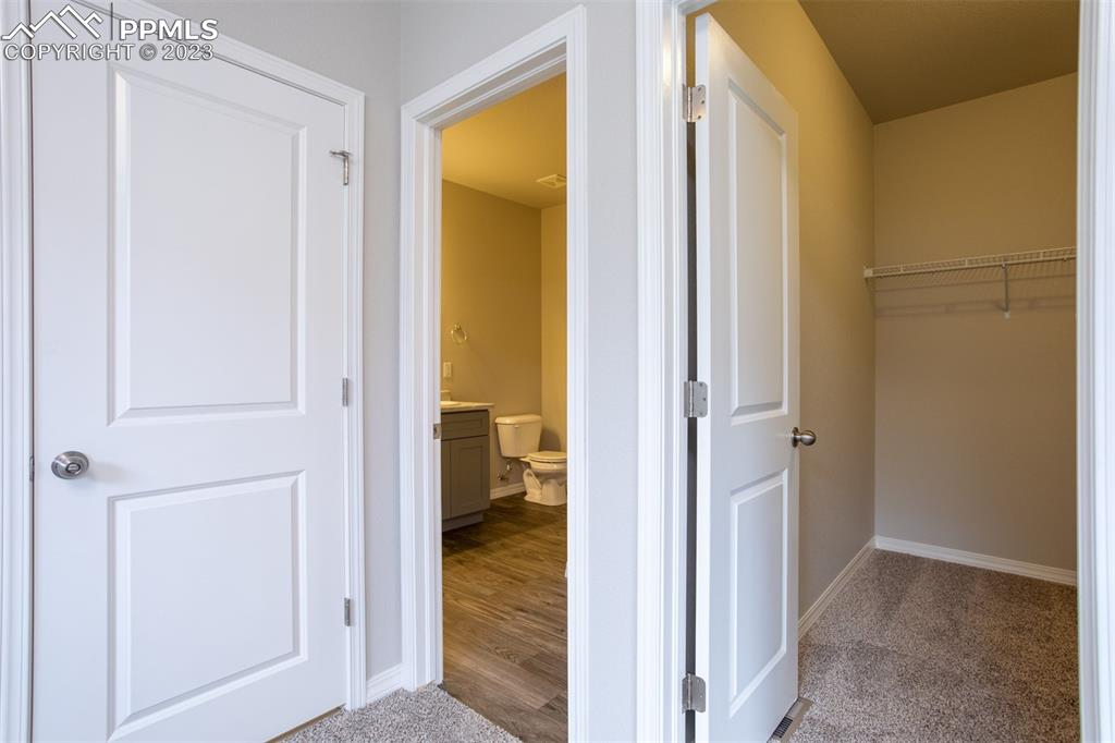 4447 Samaritan Loop Colorado Springs, CO 80916 - Photo 15 of 17 a view of a bathroom from a hallway