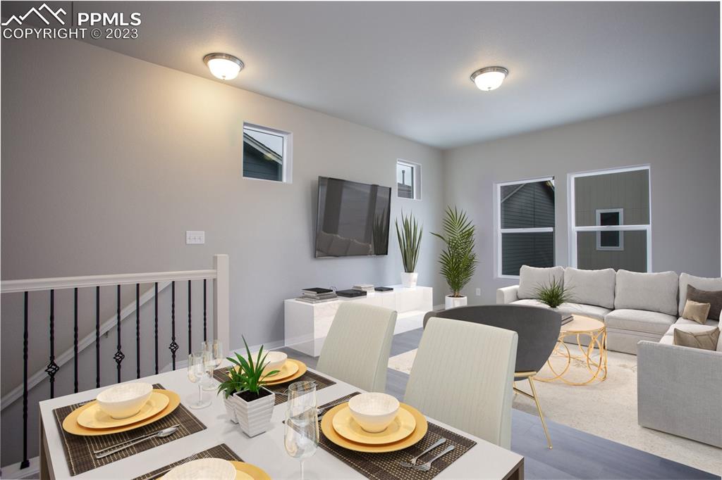 4447 Samaritan Loop Colorado Springs, CO 80916 - Photo 9 of 17 a living room with furniture and a flat screen tv