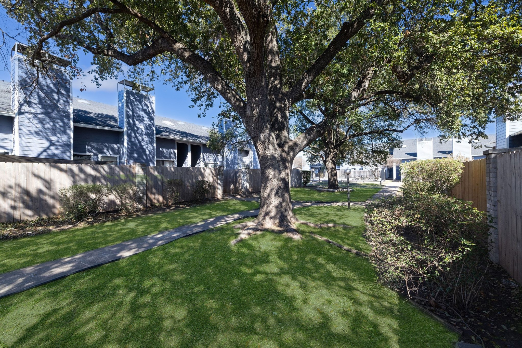 1010 West Rundberg Lane, Unit 30 Austin, TX 78758 - Photo 21 of 30 a backyard of a house with lots of green space